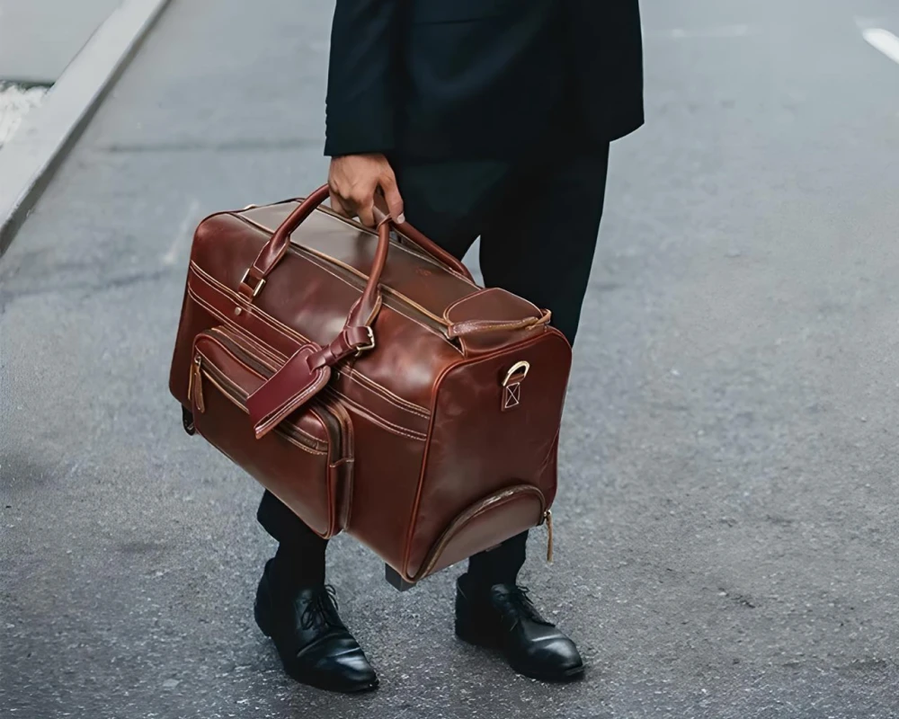 leather rolling carry on bag